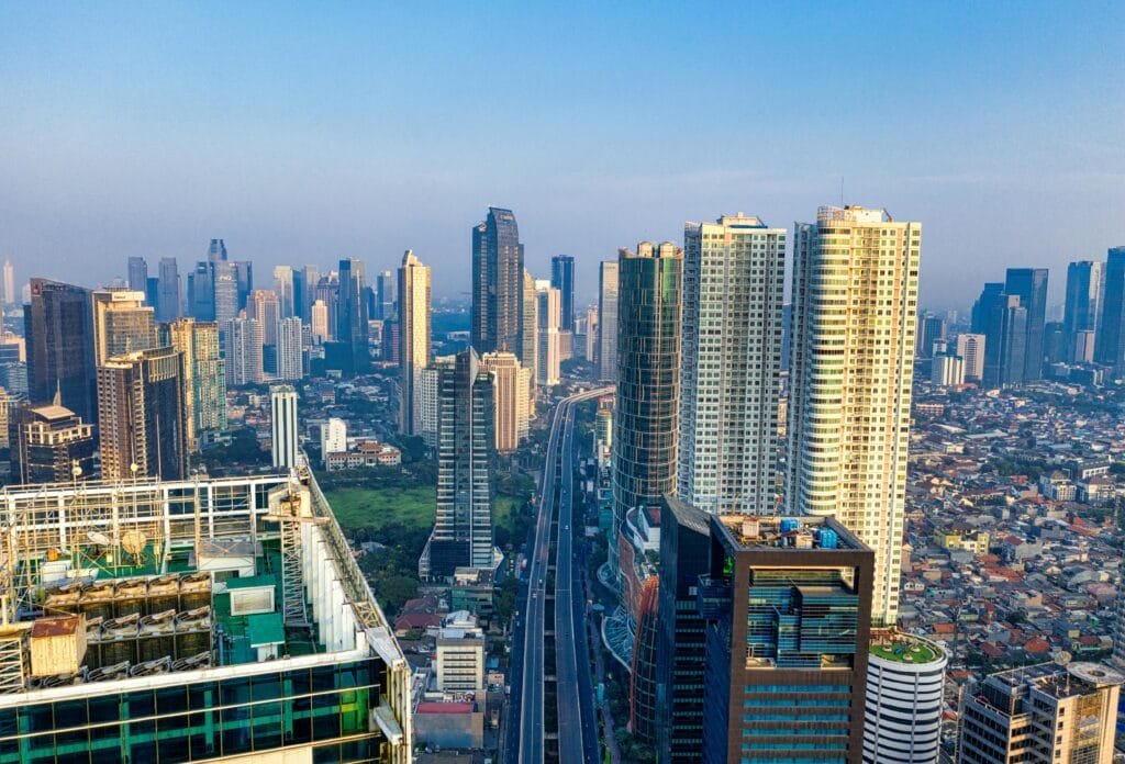 Breathtaking aerial view of South Jakarta's modern skyline featuring towering skyscrapers and cityscape under a clear sky.